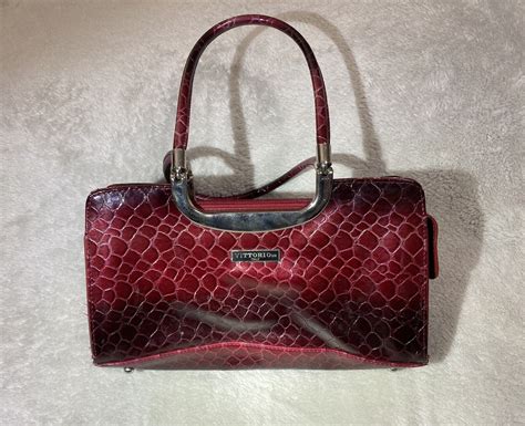 Shop Women's <b>Vittorio</b> Red Size OS Satchels at a discounted price at Poshmark. . Vittorio purse